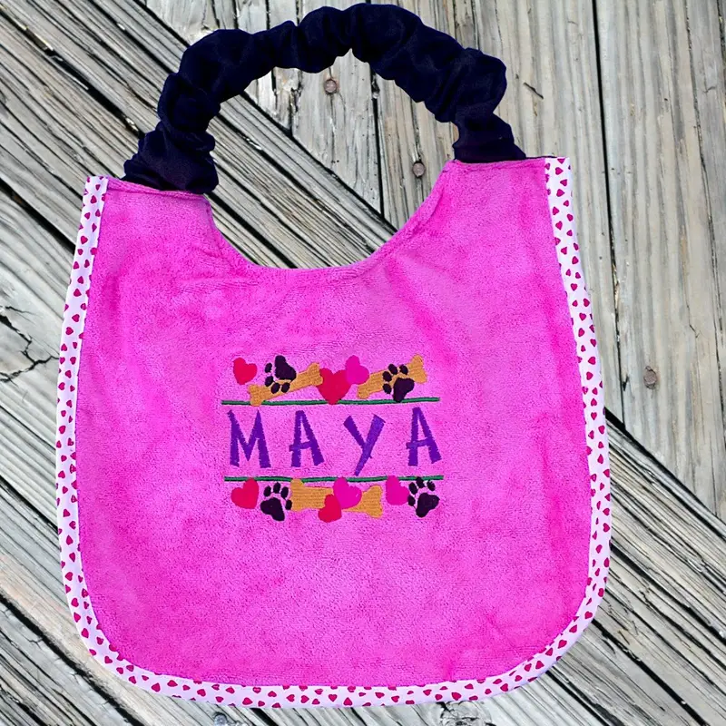 Heart, paw & bone stylish border dog bib with personalised name: bone hearts border