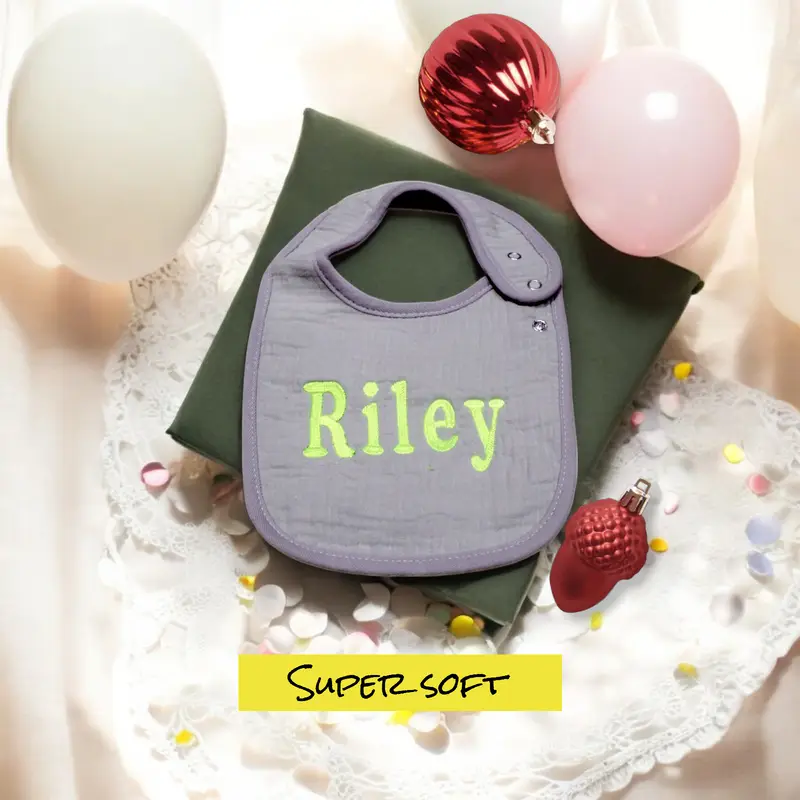 Close-up of high-quality embroidery on a personalised baby bib, ensuring long-lasting charm