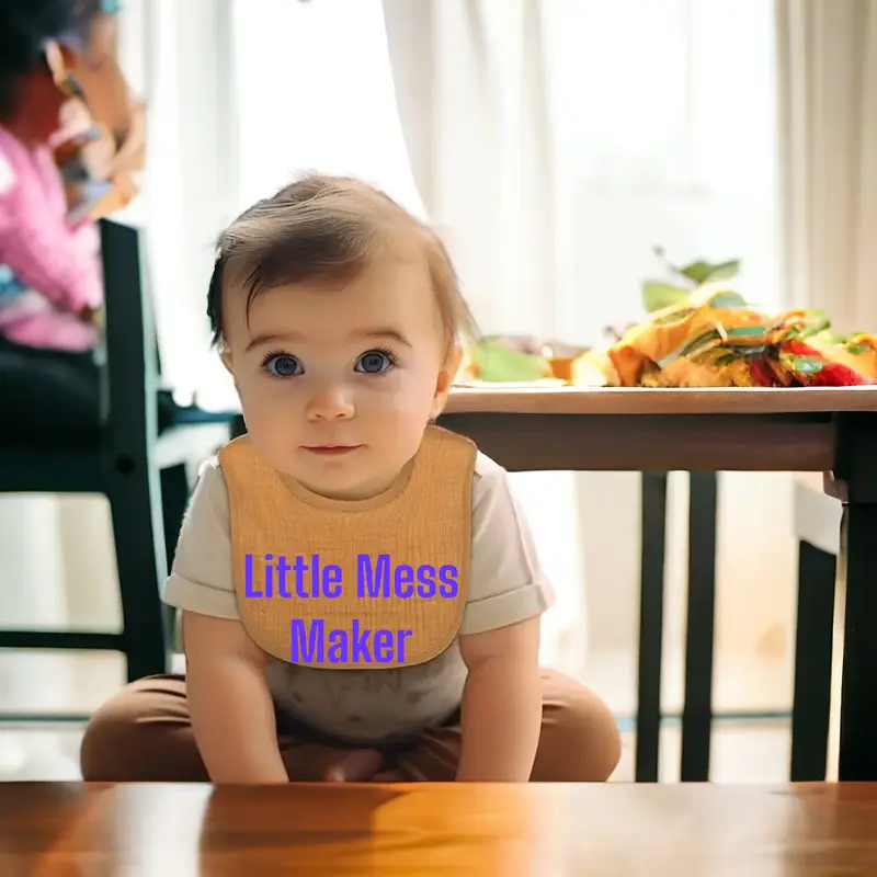 Premium baby bibs with playful embroidered designs, designed to keep babies clean and add laughter to mealtimes.