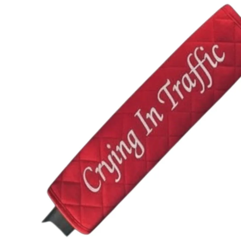 Seat belt cover embroidered with Crying In Traffic