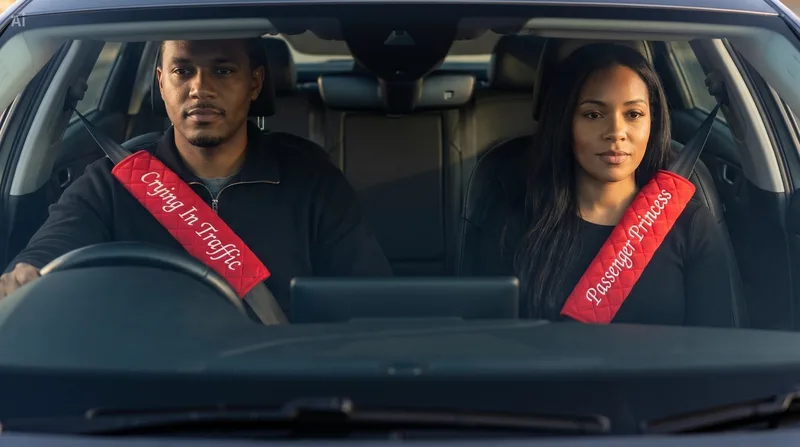 Red seat belt covers with Crying In Traffic and Passenger Princess in a car