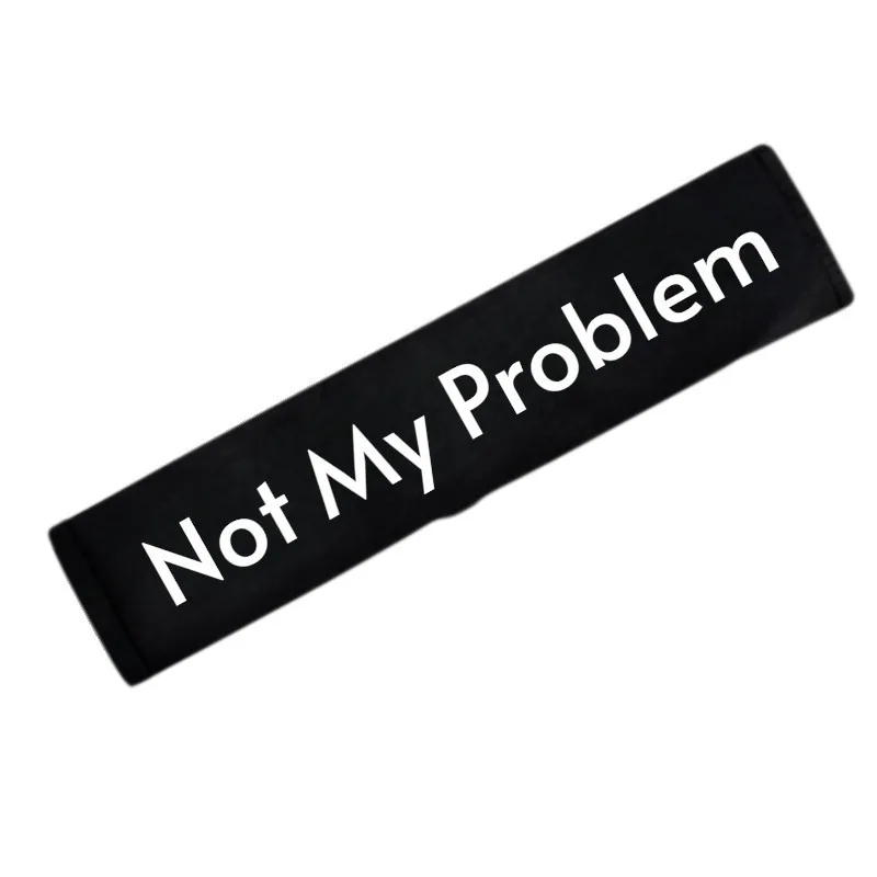 Seat belt cover embroidered with Not My Problem