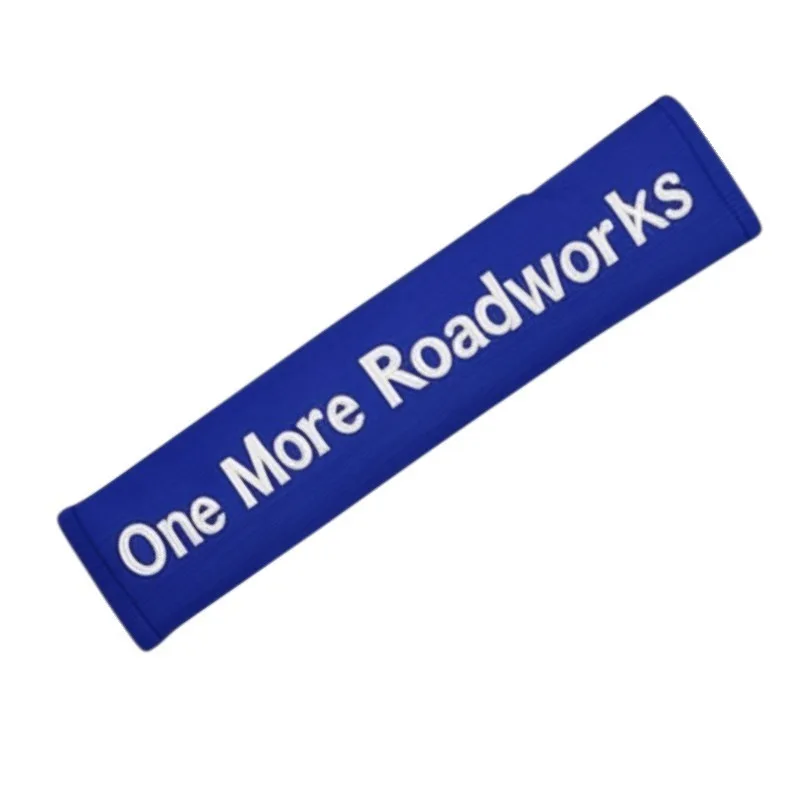 Seat belt cover embroidered with One More Roadworks