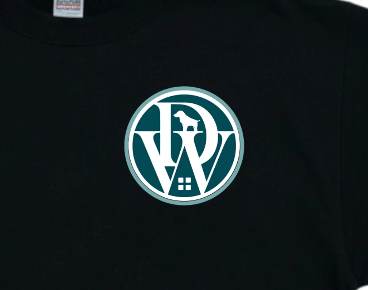 Close-up of an embroidered business logo on a black sweatshirt (example shown with the DoggiesWorld logo)