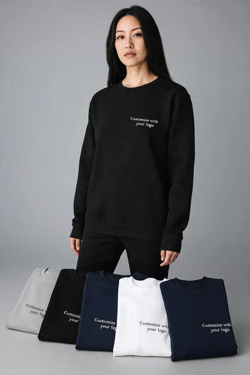 Black sweatshirt with a logo on the left chest, and folded sweatshirts in grey, black, navy and white